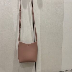 Stylish Tan Crossbody Bag with Smooth Texture and Long Strap